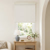 Custom Harlan jacquard blackout roller blind in white on a window