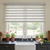Linen-look zebra blind in white, custom window treatment with light-filtering sheer bands