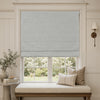 Alder linen look blackout Roman blind in light gray on a window