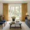 Custom ochre velvet curtains with soft brushed texture and elegant drape.