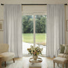 Oak cotton linen semi-blackout curtains with natural textured weave in light neutral.