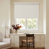 Beige linen jacquard blackout roller blind partially lowered over window