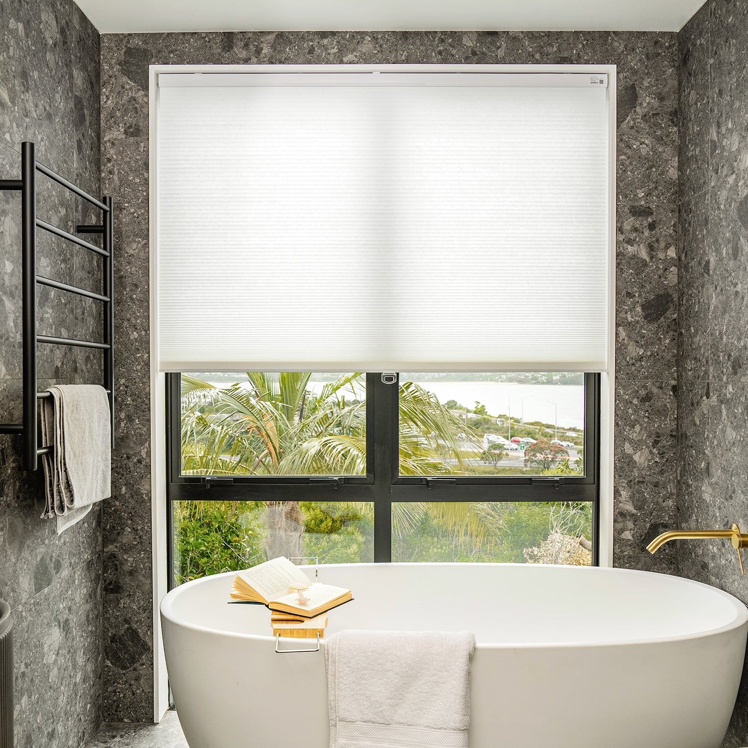 Solace Light Filtering Cellular Shade in white, controls soft light.